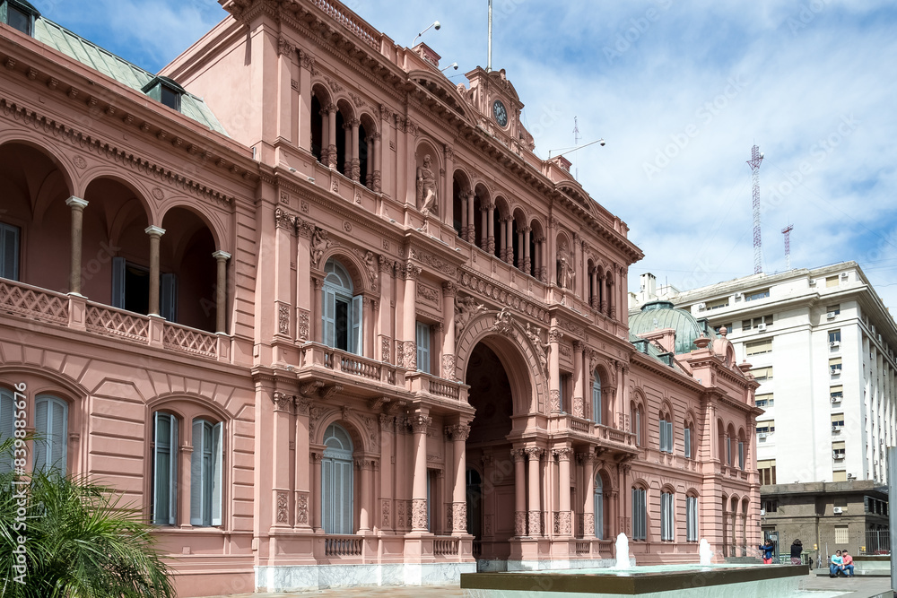 Fototapeta premium View of Casa Rosada (Pink House), the executive mansion and office of the President of Argentina and located in the historic center of the federal capital city of Buenos Aires.