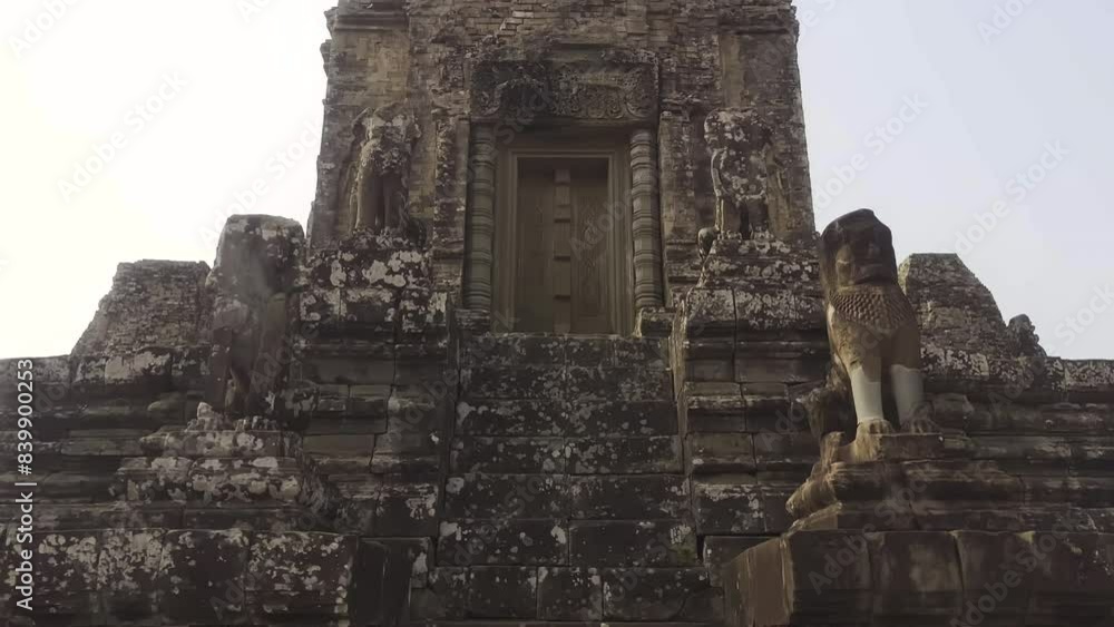 The peak of ancient temple ruins. East Mebon Temple in the Angkor Wat archaeological complex. Khmer civilization. Siem Reap, Cambodia. The peak of ancient temple ruins. East Mebon Temple in the Angkor Wat archaeological complex. Khmer civilization. Siem Reap, Cambodia.