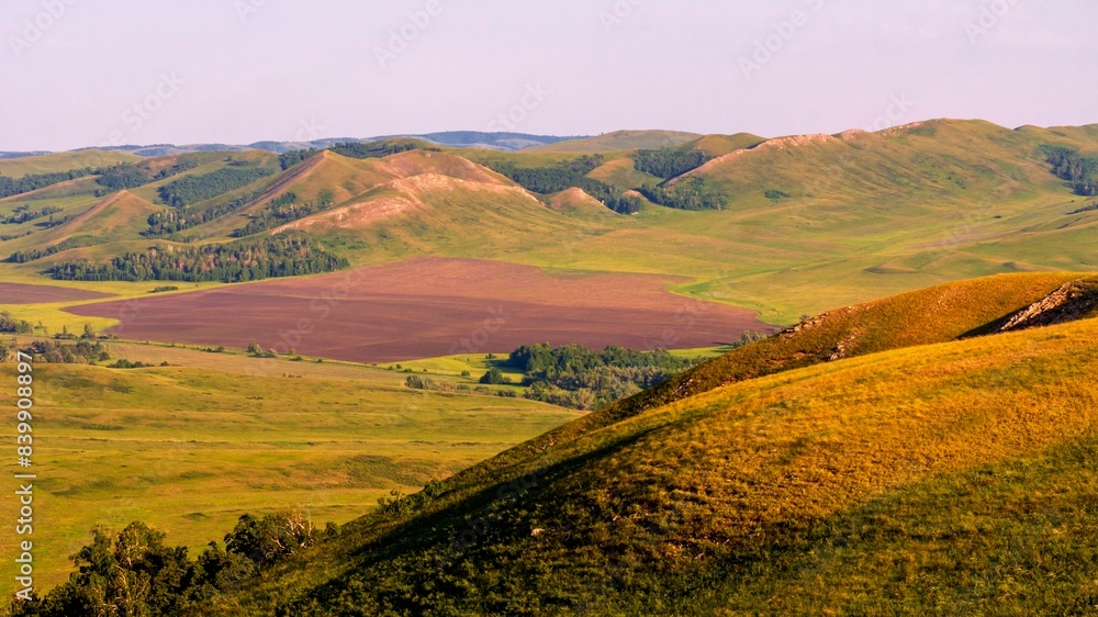 Magnificent landscape of the Karamuruntau ridge in the rays of the setting sun Magnificent landscape of the Karamuruntau ridge in the rays of the setting sun