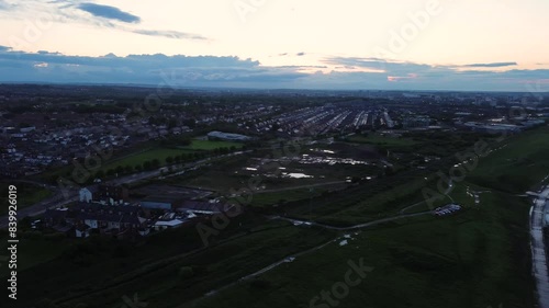 Panning aerial shot of Hendon and Sunderland coastline during sunset. England, UK photo