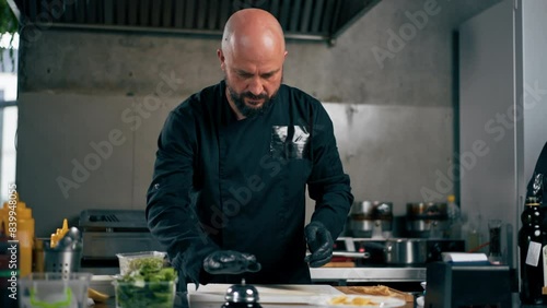 in professional kitchen in a white plate ready-made carbonara pasta the chef gives out the order
