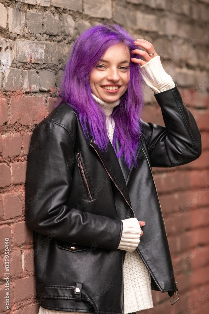 Portrait of a young beautiful girl with purple hair in the autumn city. Portrait of a young beautiful girl with purple hair in the autumn city.