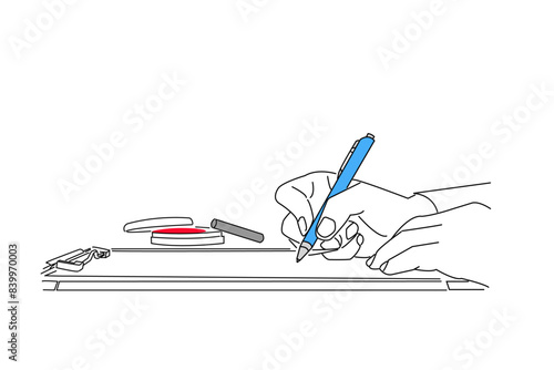 契約書・書類を書き込む人物の手元