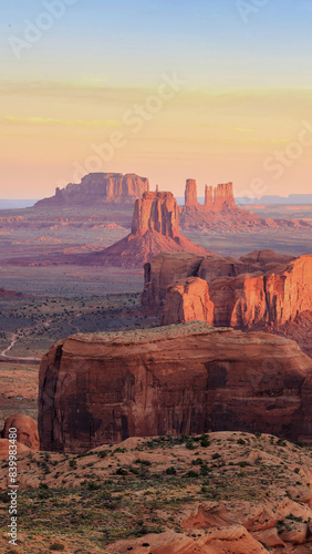Monument Valley, a red-sand desert region on the Arizona-Utah border, is known for the towering sandstone buttes of Monument Valley Navajo Tribal Park