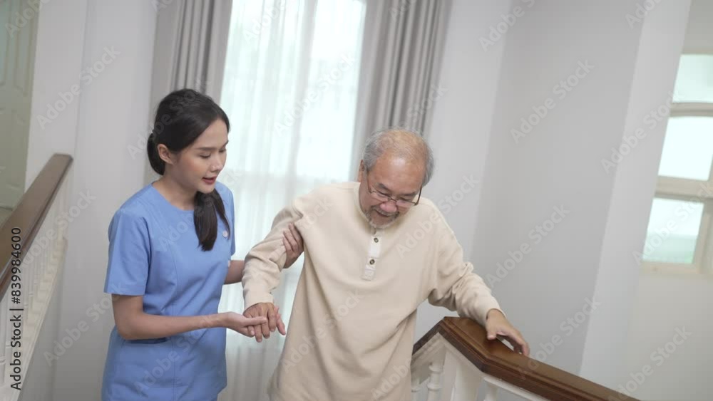 Health care worker is assisting senior man walking on the stairs at home. Health care worker is assisting senior man walking on the stairs at home.