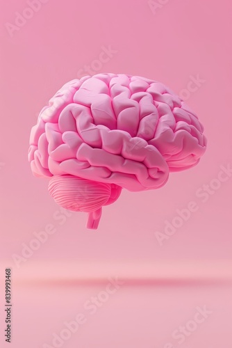 A pink brain floats against a pink background. The image is minimal and focuses on the brain, highlighting its unique shape and texture