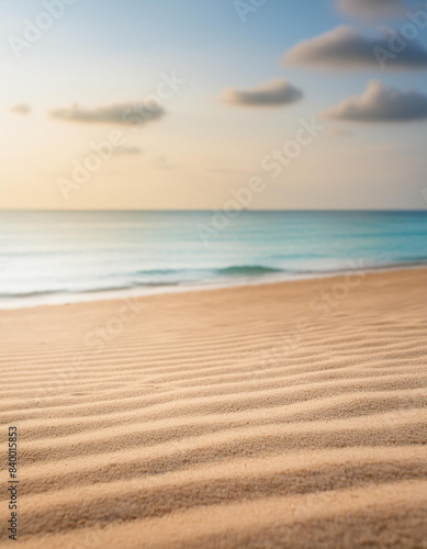 Seascape abstract beach background blur light of calm sea and sky focus on sand foreground