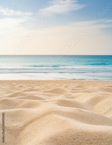 Fototapeta Naklejka Na Ścianę i Meble -  Seascape abstract beach background blur light of calm sea and sky focus on sand foreground