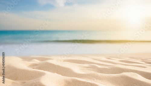 Seascape abstract beach background blur light of calm sea and sky focus on sand foreground