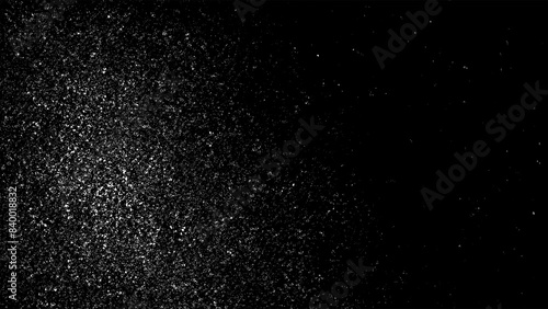 Distressed grainy white fine dust particles speckled gradient texture on a black background