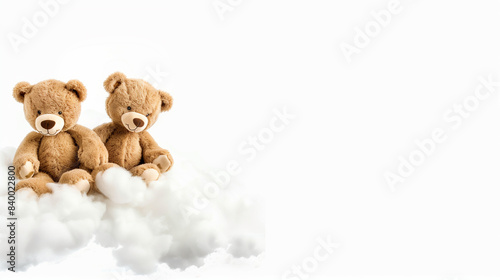 Teddy bears on the left cloud, white background, space for text on the right. Great for congratulations cards.  © Alena