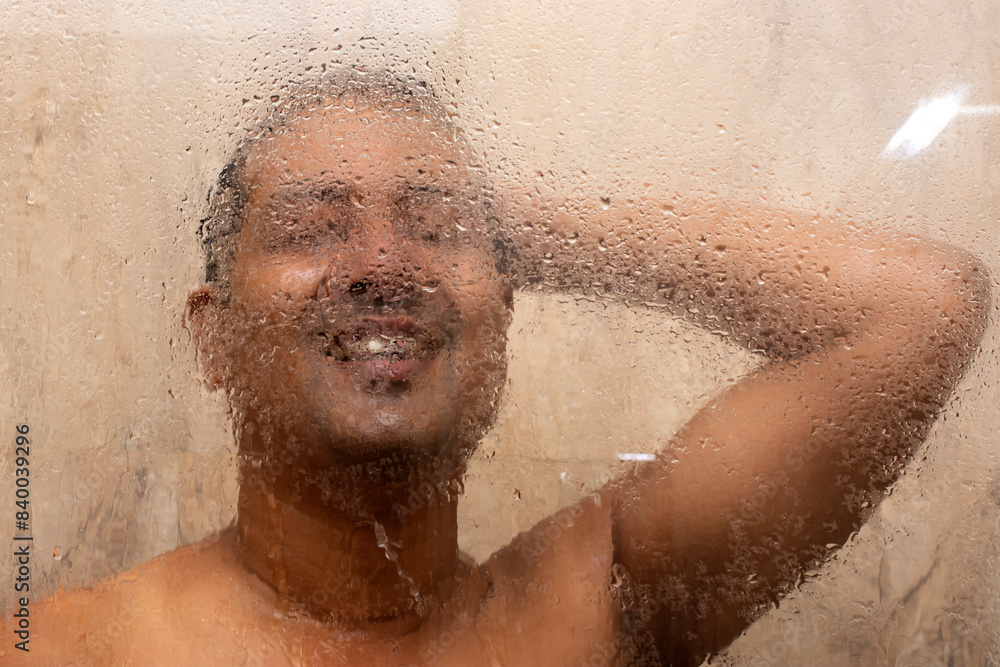Fototapeta premium Refreshing Shower: Young Man Enjoying a Morning Bath.