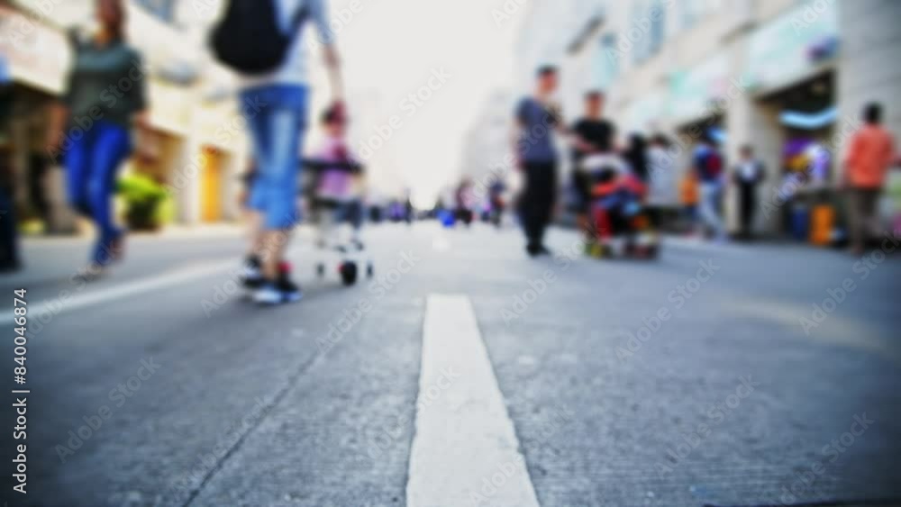 Defocused crowd of people walking on the street Defocused crowd of people walking on the street