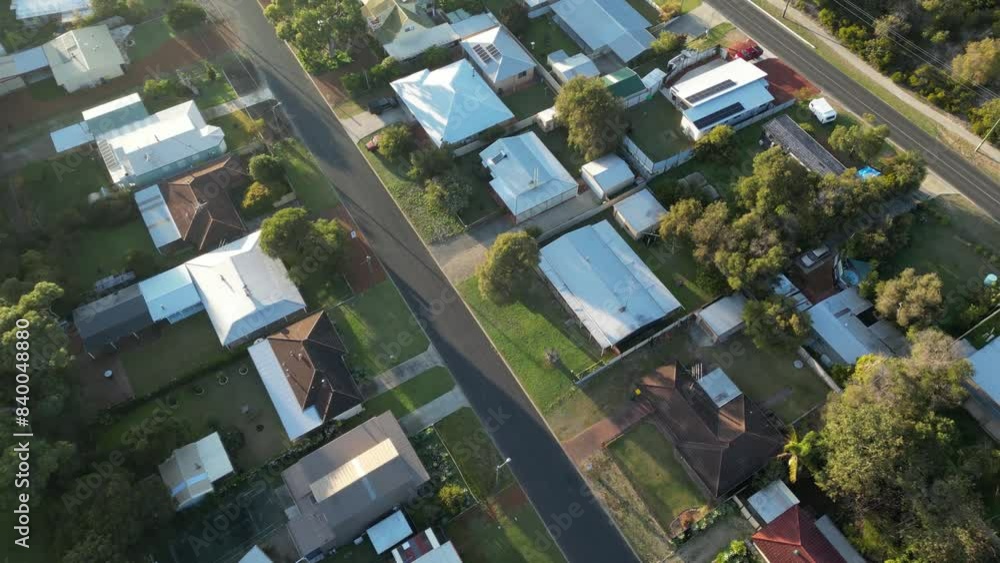 Roof of houses in Preston beach town during sunset time. Australian city in the evening. Street and homes during summer day. Aerial top down. Roof of houses in Preston beach town during sunset time. Australian city in the evening. Street and homes during summer day. Aerial top down.