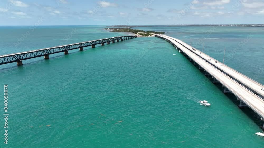 aerial pullout over seven mile bridges in the florida keys with boats, fishing boats around bridge aerial pullout over seven mile bridges in the florida keys with boats, fishing boats around bridge