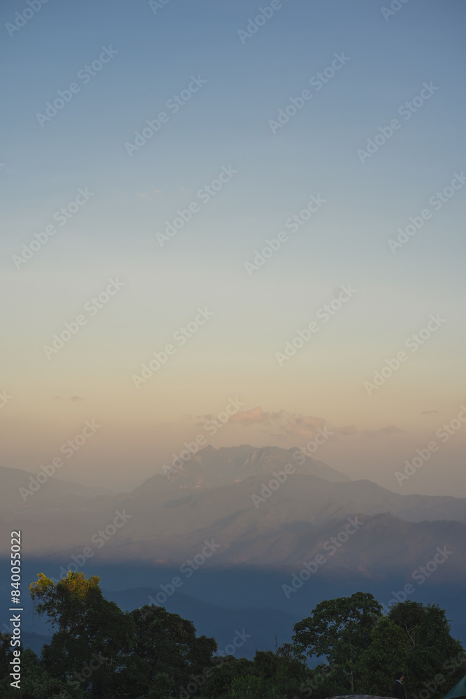 travel and people activity concept with twilight sky before sunset with layer of mountain travel and people activity concept with twilight sky before sunset with layer of mountain