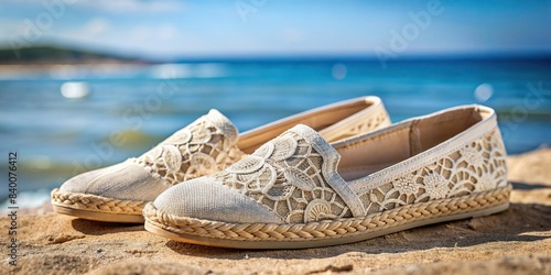 Linen espadrilles with lace detailing on a coastal background , footwear, espadrilles, linen, lace, delicate, elegant, coastal, summer, beach, vacation, timeless, carefree, stylish photo