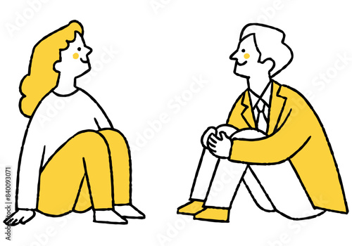 Man and woman sitting in gym and looking up