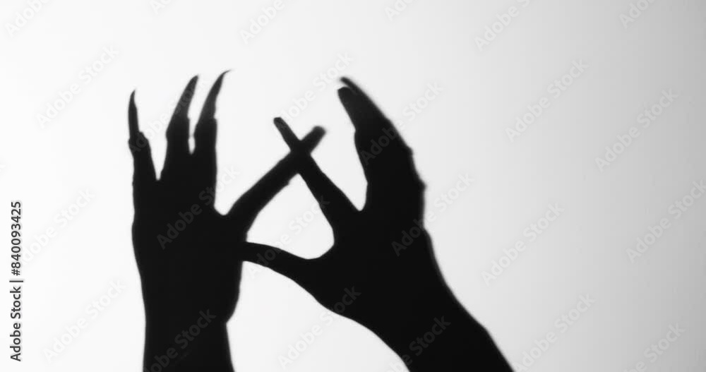 Shadow of a zombie hand on white background
Shadow of a zombie hand on white background