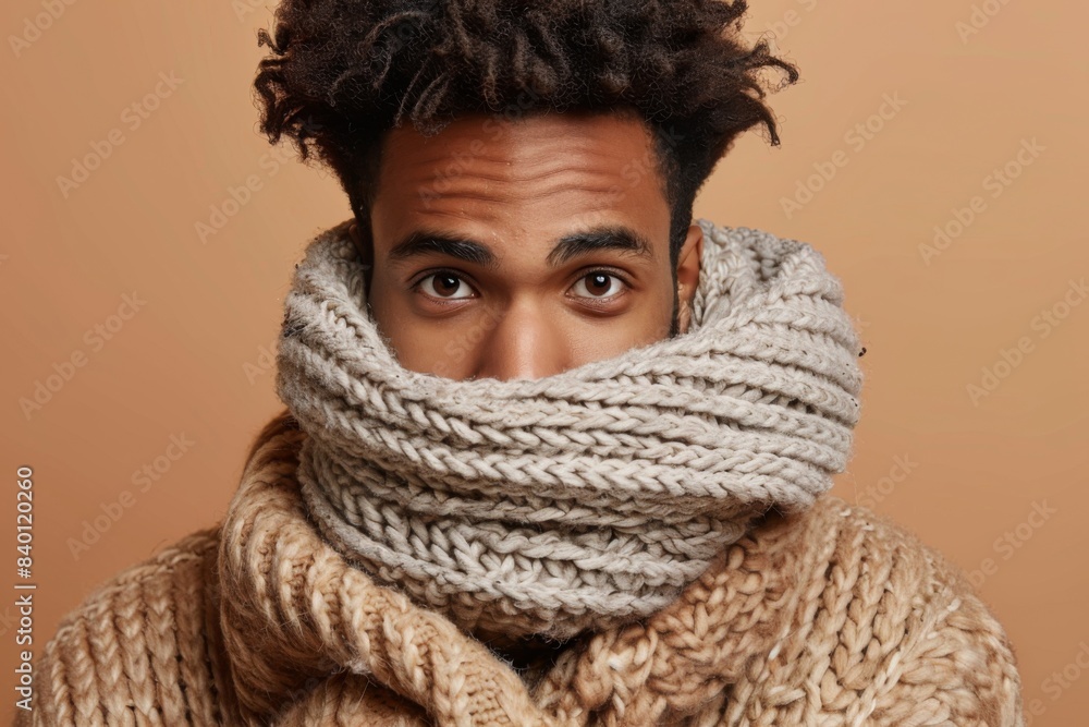 Man wearing scarf and sweater around neck Man wearing scarf and sweater around neck