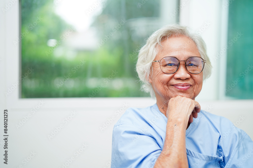 Asian senior woman wearing eyeglasses or vision glasses at home care service. Asian senior woman wearing eyeglasses or vision glasses at home care service.