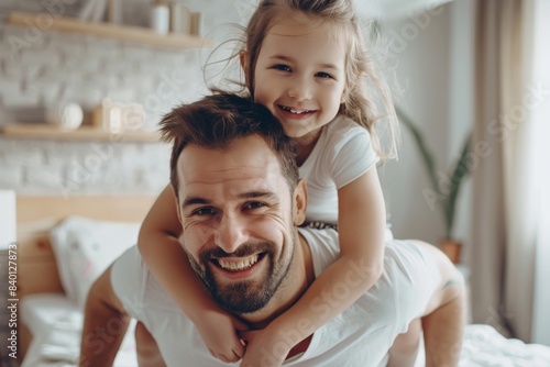 Father and daughter playing together. Father's Day concept.