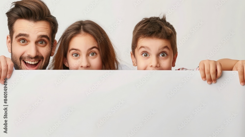 Family offer. Excited european parents and their daughter peeking out of blank white placard board with free space for your advertisement and design, banner Family offer. Excited european parents and their daughter peeking out of blank white placard board with free space for your advertisement and design, banner