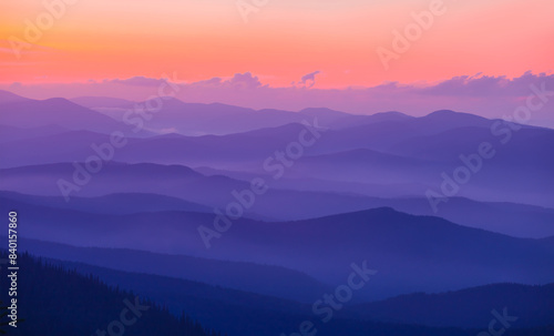 mountain ridge silhouette in mist at the twilight