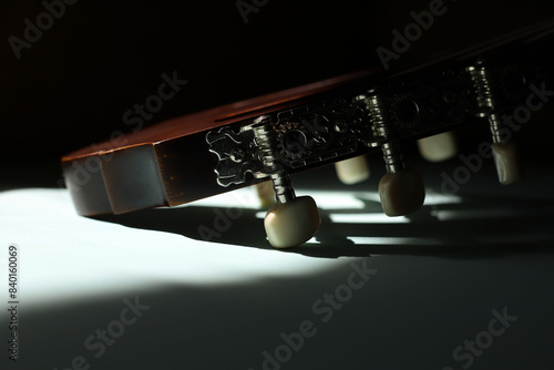 musical instruments. close-up of part of the guitar headstock and tuners