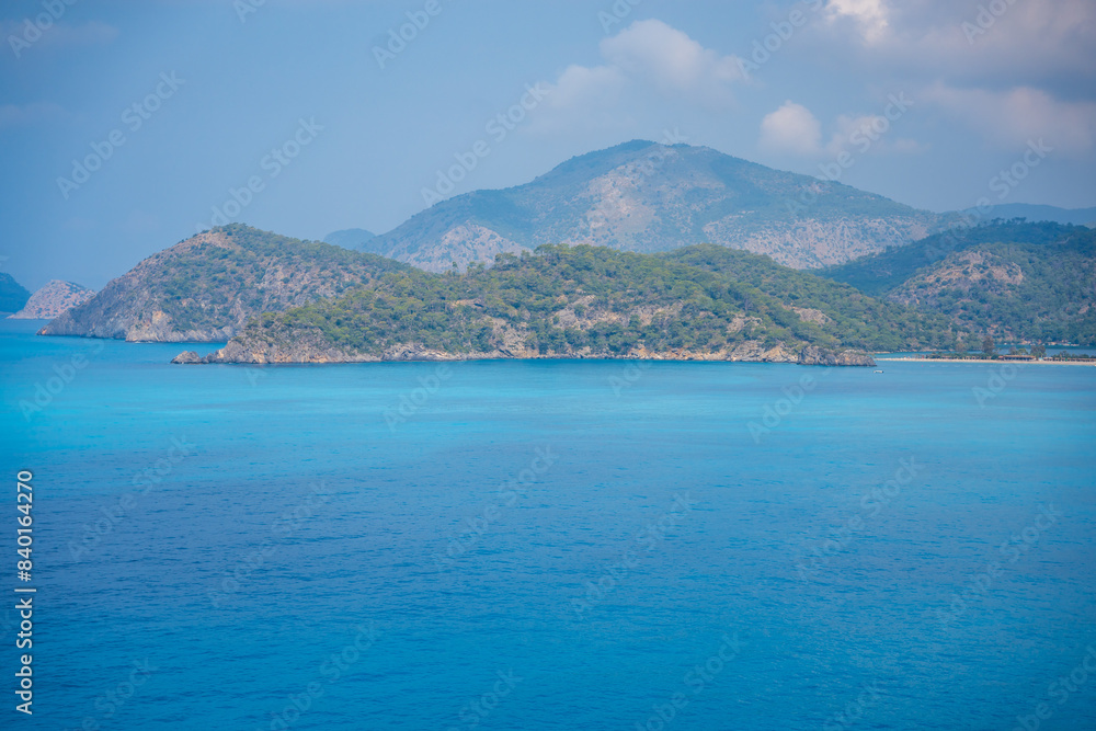 Aerial view of Oludeniz beach with people and boats in the morning, Coastline next to Fethiye, Turkey Aerial view of Oludeniz beach with people and boats in the morning, Coastline next to Fethiye, Turkey