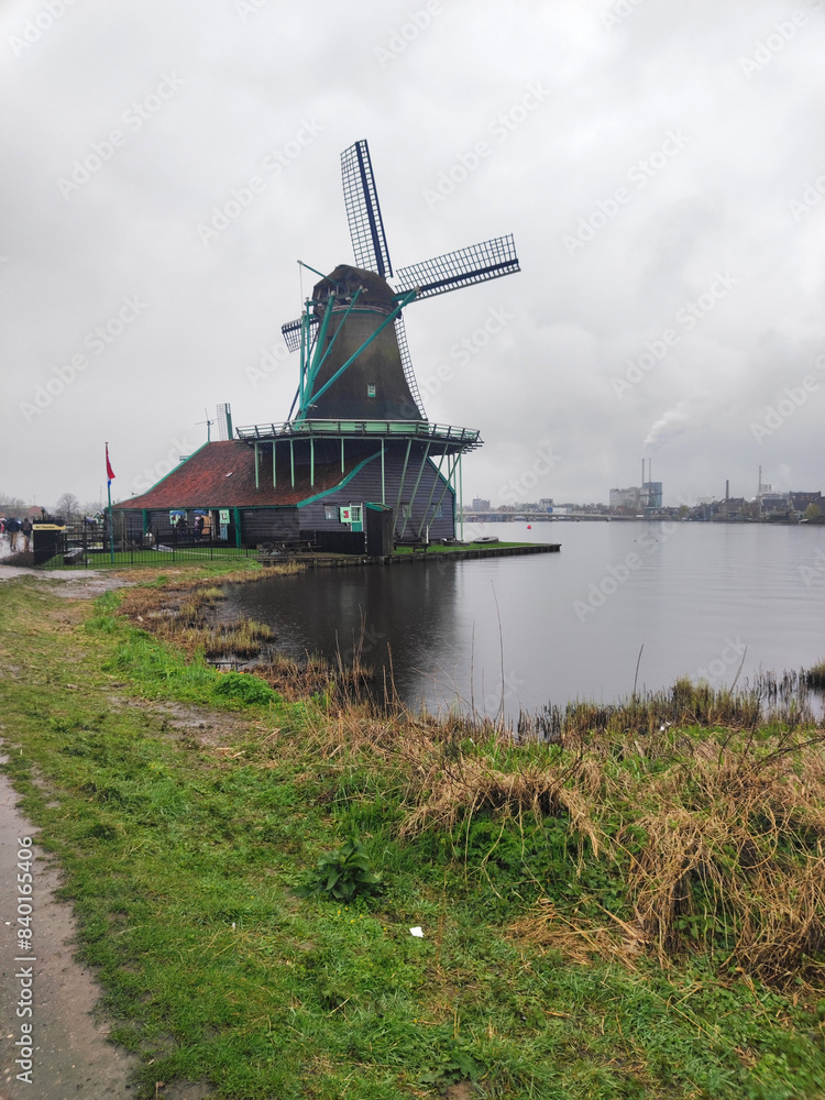 Naklejka premium The Zaanse Schans windmills in rainy day