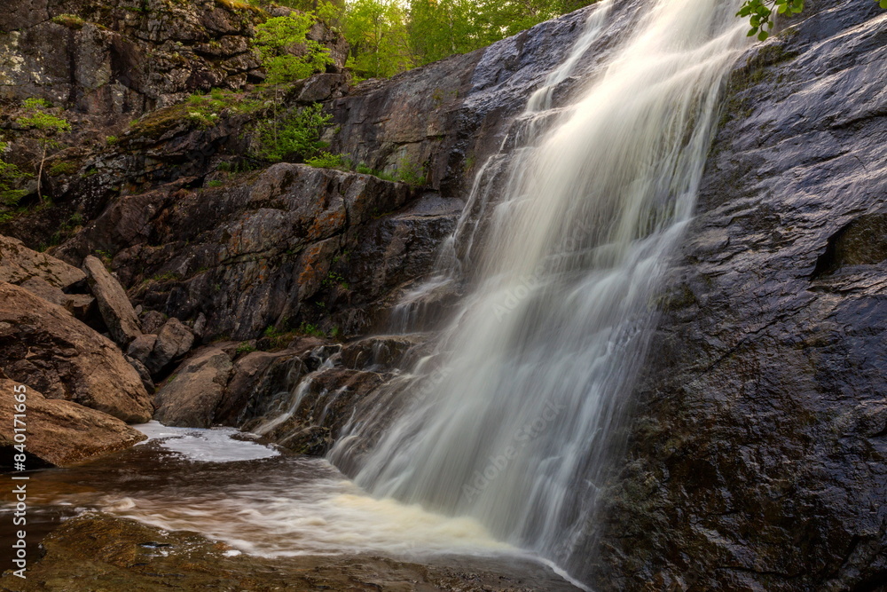 Fototapeta premium Gadelsha waterfall is the largest waterfall in the Southern Urals on a summer sunny day