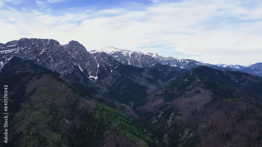 Aerial view of Giewont summit in Tatra mountains. Panoramic landscape with mountain ranges against morning sky. Travel tourism concept Aerial view of Giewont summit in Tatra mountains. Panoramic landscape with mountain ranges against morning sky. Travel tourism concept