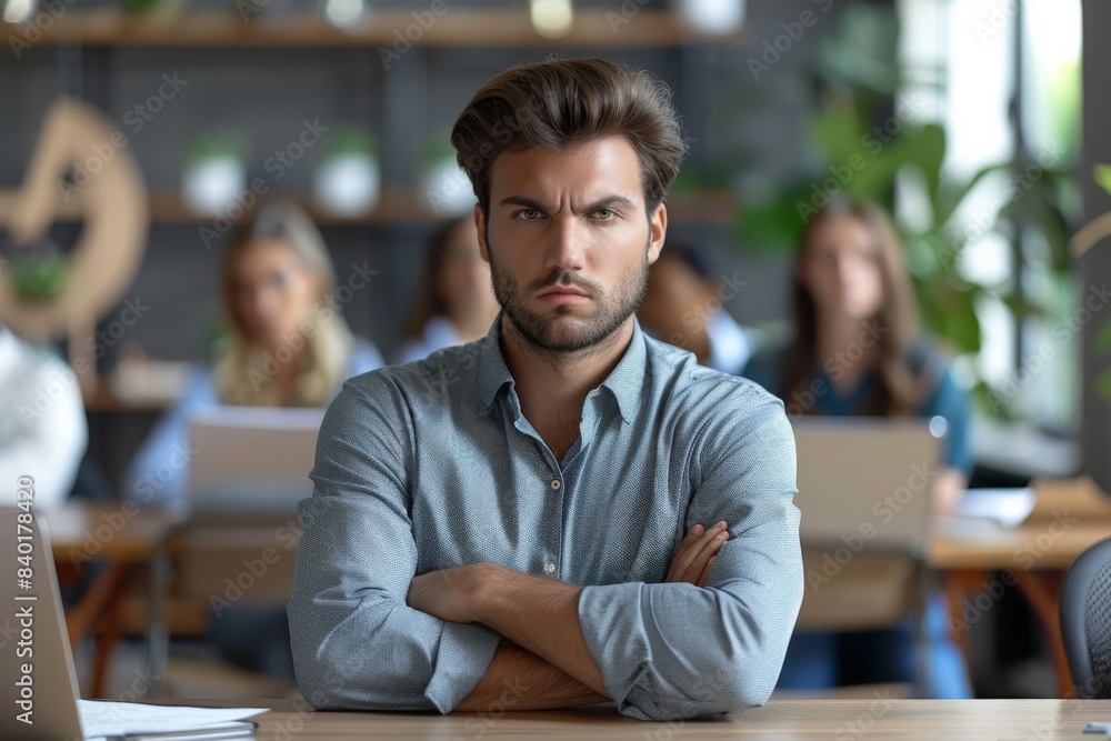 Fototapeta premium Man seated, arms crossed