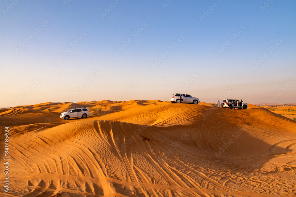 Ras Al Khaimah, United Arab Emirates - May 06, 2024: jeep safari in the desert at sunset Ras Al Khaimah, United Arab Emirates - May 06, 2024: jeep safari in the desert at sunset