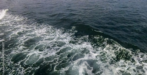 Aerial view to ocean waves. Blue water background