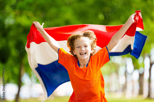 Netherlands team supporter. Dutch kid with flag. photo