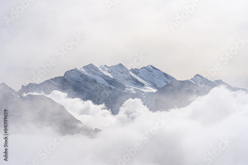 Obraz na płótnie View of Swiss Alps over clouds on a bright sunny day from Schilthorn summit in Switzerland w salonie