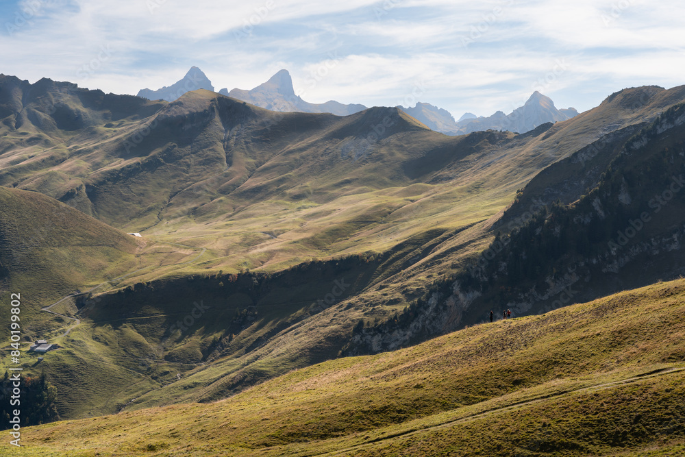 People walking on a ridge of a mountain in Stoos, Switzerland. Swiss Alps iconic aerial view