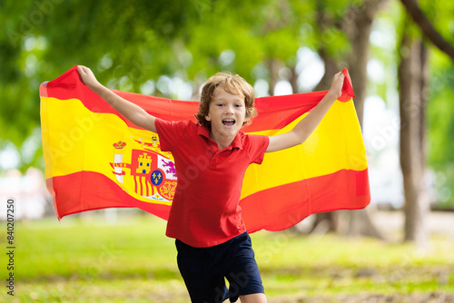 Canvas Print Child running with Spain flag. Little Spanish fan.