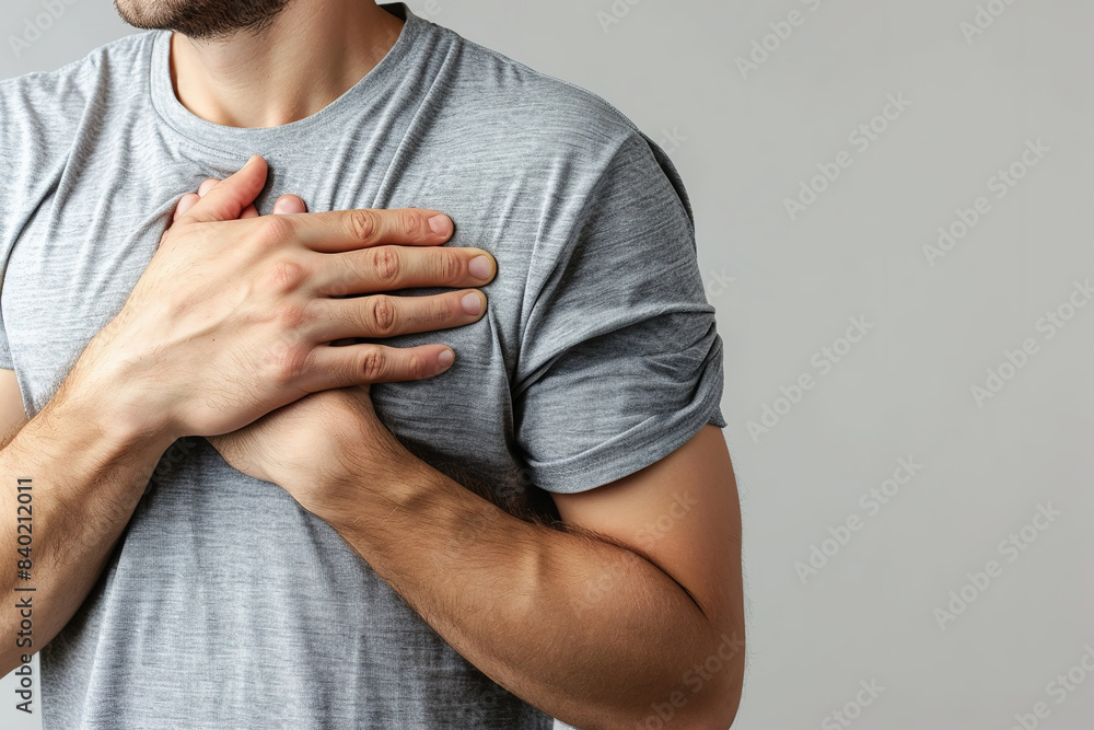 Middle aged man experiencing frozen shoulder symptoms, pain and discomfort Middle aged man experiencing frozen shoulder symptoms, pain and discomfort