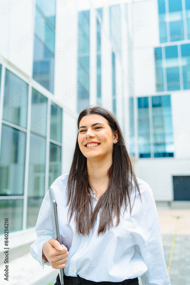 One young successful business woman going to work at business office modern building while holding coffee and laptop
One young successful business woman going to work at business office modern building while holding coffee and laptop