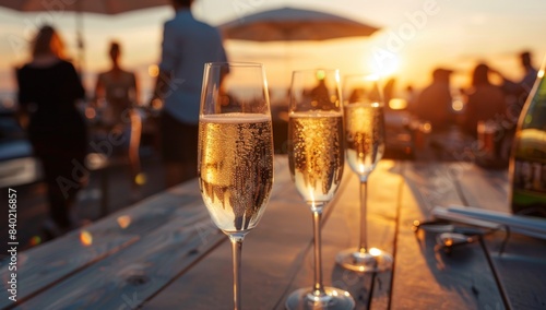 photo of champagne glasses lined up on the table