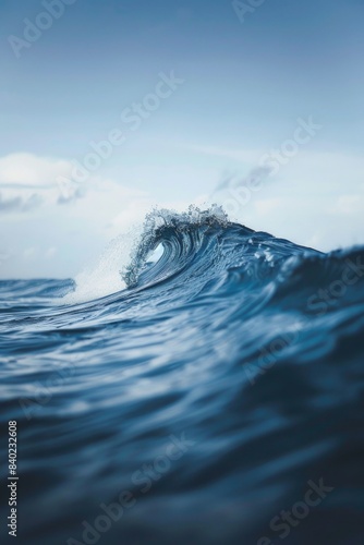 A large wave breaking in the middle of the open ocean