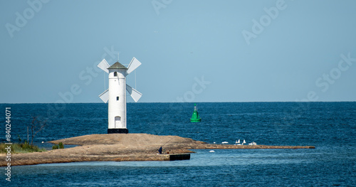 Panoramic image of an old lighthouse in Swinoujscie, a port in Poland on the Baltic Sea. photo