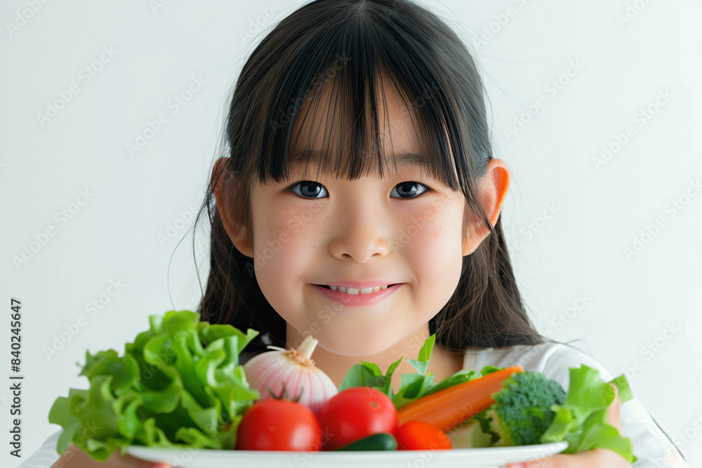 Smiling Girl Holding Plate of Fresh Vegetables
Smiling Girl Holding Plate of Fresh Vegetables