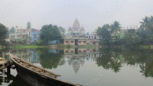 Shiva temple in Puthia Bangladesh. Beautiful lake landscape and reflection photo