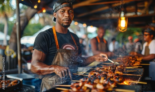 team of cooks grilling jerk chicken drumsticks