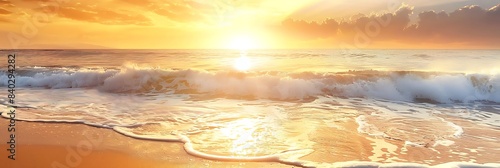 a white wave crashes onto the beach as the sun sets in the background