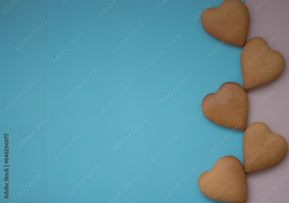 Obraz premium Background pink and blue with hearts baked goods for loved ones